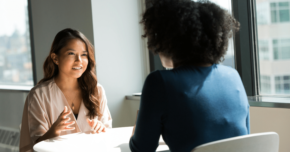image-11 - California Mental Health Depression treatment: Woman talks with therapist during early intervention session, promoting mental wellness and recovery.