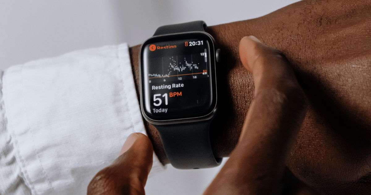image-4 - California Mental Health Social anxiety help: Person wearing a smart watch displaying a resting heart rate of 51 BPM for tips and therapy.