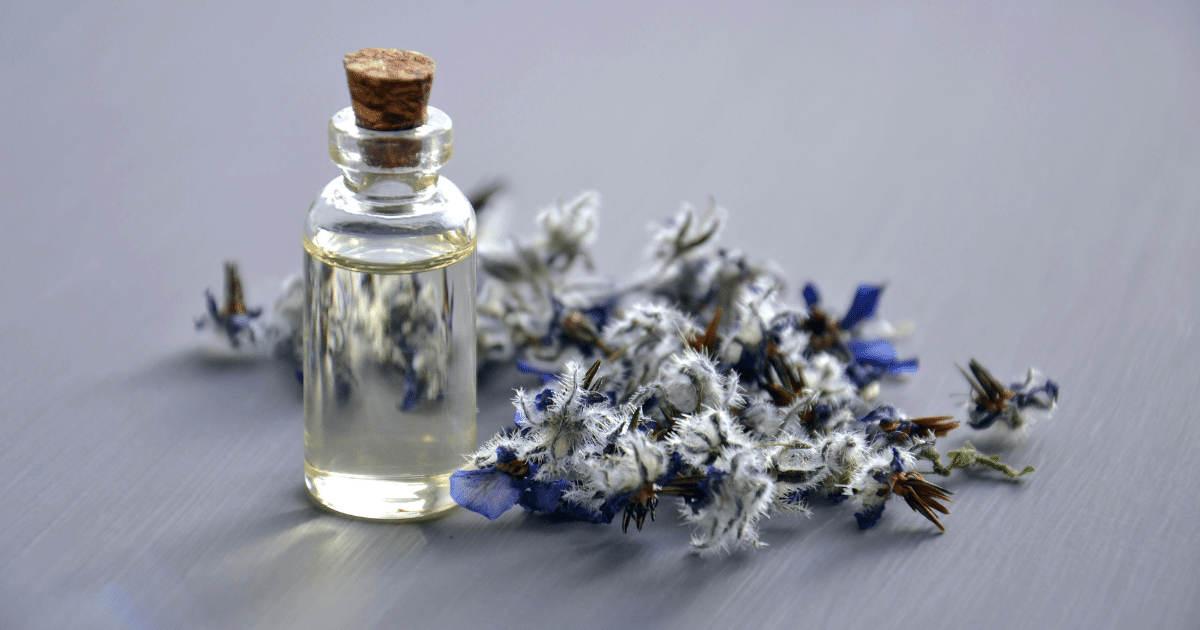 image - California Mental Health Grief and Loss Mental Health: Essential oil bottle with dried flowers, promoting relaxation and well-being during difficult times.