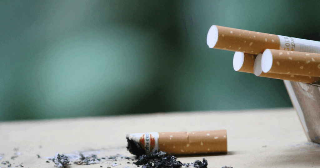image - California Mental Health Smoking and Anxiety: Cigarettes in ashtray. Nicotine addiction and its complex relationship with anxiety concept.