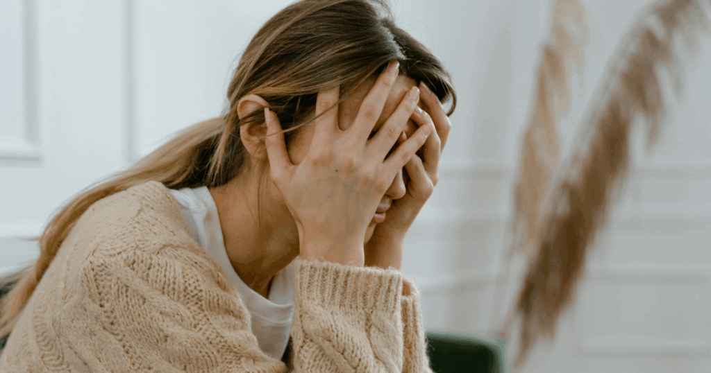 image - California Mental Health Woman covering face, depicting exhibitionistic disorder, a psychological dimension of mental health and related challenges.