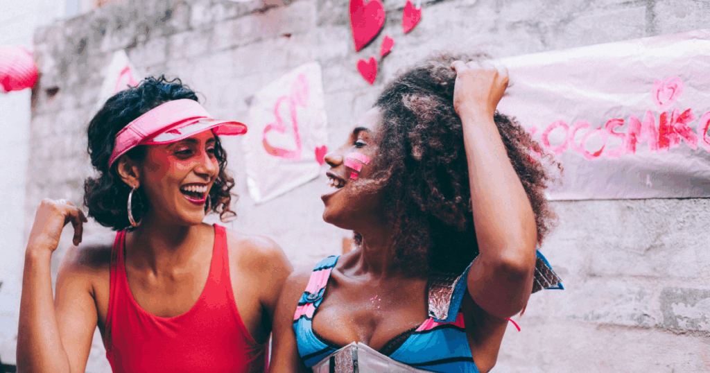 image - California Mental Health Two cheerful women smiling outdoors. Addressing the complexities of Persistent Genital Arousal Disorder (PGAD) with joy and support.