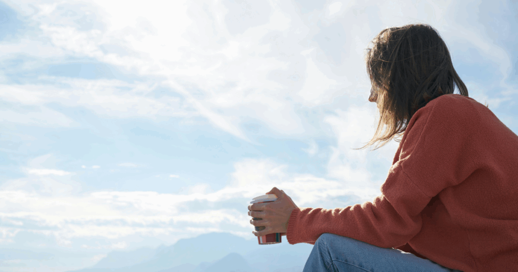 image - California Mental Health Woman with coffee cup contemplates outdoors. Mental health and psychology concepts, could relate to frotteuristic disorder.