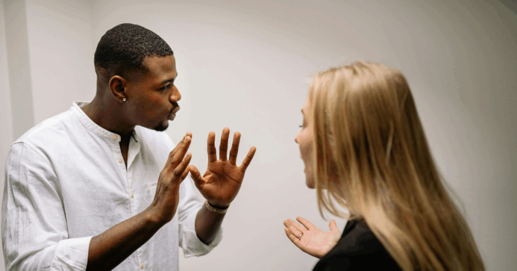 image - California Mental Health Conflict between a man and woman, possibly related to Olfactory Reference Syndrome analysis or relationship issues. Communication breakdown.