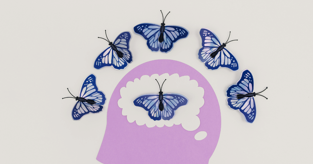 Mental well-being check-in: Butterflies surrounding a head silhouette, symbolizing mental health and positive thoughts.