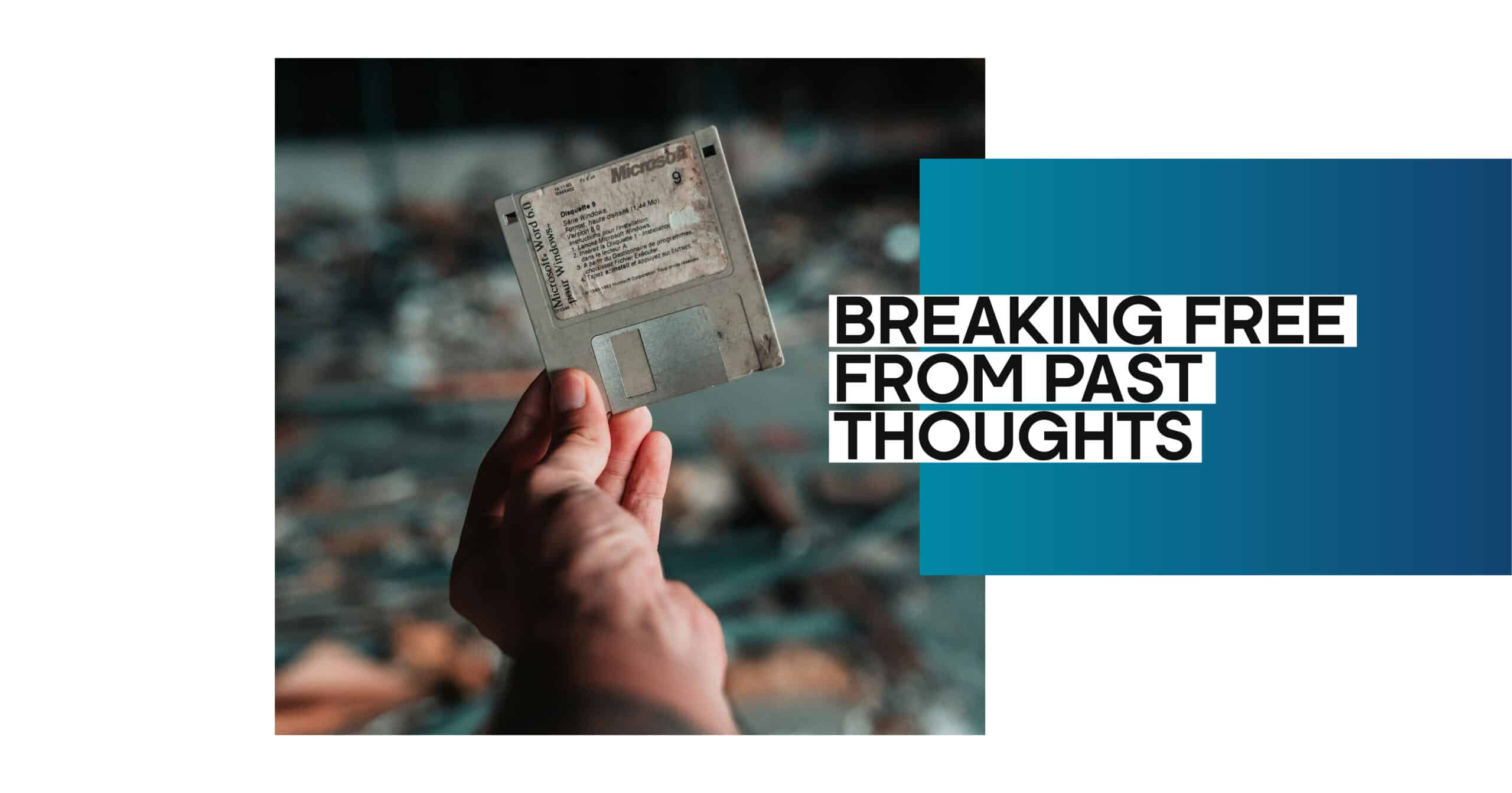 Breaking free from mental chains: Hand holding a floppy disk, symbolizing overcoming past thoughts and outdated mental habits.