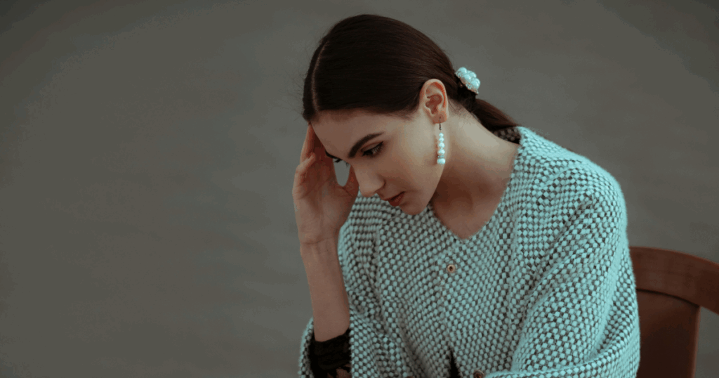 Woman experiencing a panic attack, seeking insights for a calmer mind. Mental health and anxiety relief concept.